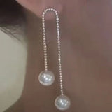 Boucles d'oreilles perles à pompon en strass