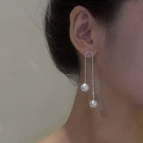 Boucles d'oreilles perles à pompon en strass