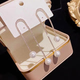 Boucles d'oreilles perles à pompon en strass