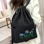 Sac à bandoulière brodé avec pochette à cordon
