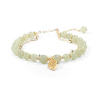 Boucles d'oreilles en rameaux d'or et feuilles de jade