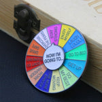 Broche en forme de roue tournante