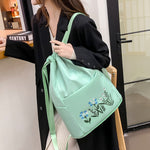 Sac à bandoulière brodé avec pochette à cordon