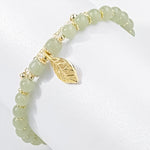 Boucles d'oreilles en rameaux d'or et feuilles de jade