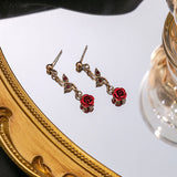 Ensemble de bijoux élégant avec collier et boucles d'oreilles en forme de fleur de rose