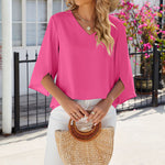 Chemise en mousseline de soie à col en V et à manches mi-longues, de couleur unie