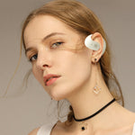 Petit casque Bluetooth en forme de noix de coco