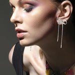Boucles d'oreilles longues avec nœud