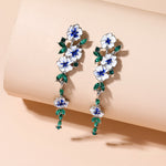 Boucles d'oreilles en chaîne à fleurs bleues