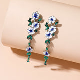 Boucles d'oreilles en chaîne à fleurs bleues