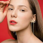 Boucles d'oreilles longues avec nœud