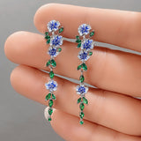 Boucles d'oreilles en chaîne à fleurs bleues