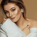 Boucles d'oreilles longues avec nœud