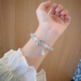 Bracelet imitation œil de chat cristal de papillon