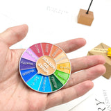 Broche en forme de roue tournante