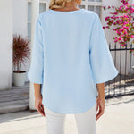 Chemise en mousseline de soie à col en V et à manches mi-longues, de couleur unie
