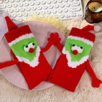 Chaussettes Père Noël tenant la main