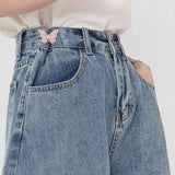Boucle de taille papillon perle