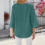 Chemise en mousseline de soie à col en V et à manches mi-longues, de couleur unie