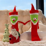 Chaussettes Père Noël tenant la main