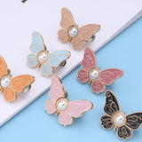 Boucle de taille papillon perle