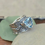 Bague en argent avec topaze bleue