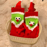 Chaussettes Père Noël tenant la main