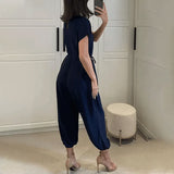 Pantalon harem à lacets et col en V