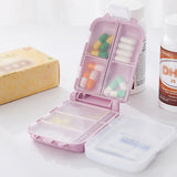 Boîte à médicaments pliante à trois compartiments