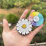 Broche en forme de roue tournante