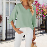 Chemise en mousseline de soie à col en V et à manches mi-longues, de couleur unie