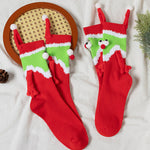 Chaussettes Père Noël tenant la main