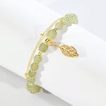 Boucles d'oreilles en rameaux d'or et feuilles de jade