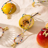 Collier de perles en forme de lettres