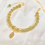 Boucles d'oreilles en rameaux d'or et feuilles de jade