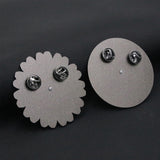 Broche en forme de roue tournante