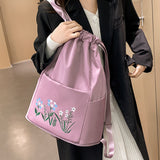 Sac à bandoulière brodé avec pochette à cordon