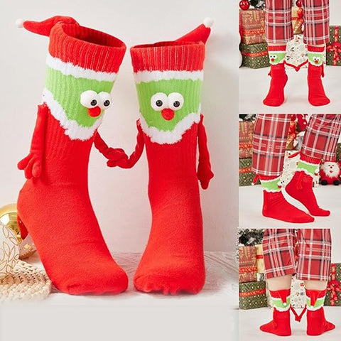 Chaussettes Père Noël tenant la main