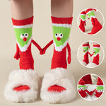 Chaussettes Père Noël tenant la main