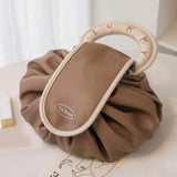 Sac à main avec cordon de serrage pour le maquillage