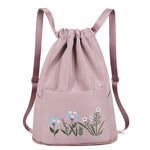 Sac à bandoulière brodé avec pochette à cordon