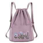 Sac à bandoulière brodé avec pochette à cordon