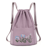 Sac à bandoulière brodé avec pochette à cordon