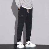 Pantalon de travail multi-poches à cordon de serrage