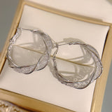 Boucles d'Oreilles Torsadées à la Mode