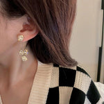 Boucles d'oreilles avec pétales ronds en zircone