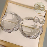 Boucles d'Oreilles Torsadées à la Mode