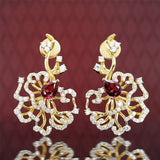 Boucles d'oreilles puces rubis cerclées d'or