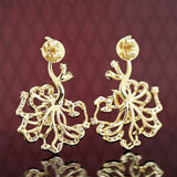 Boucles d'oreilles puces rubis cerclées d'or