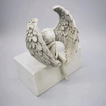 Ornement d'ange tenant une jambe